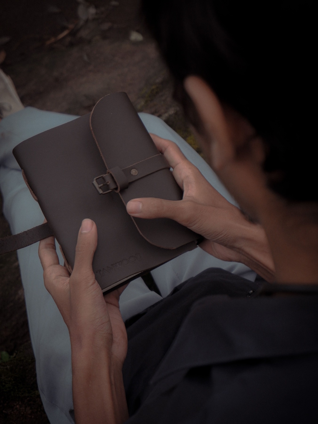 Person opening a wrap journal